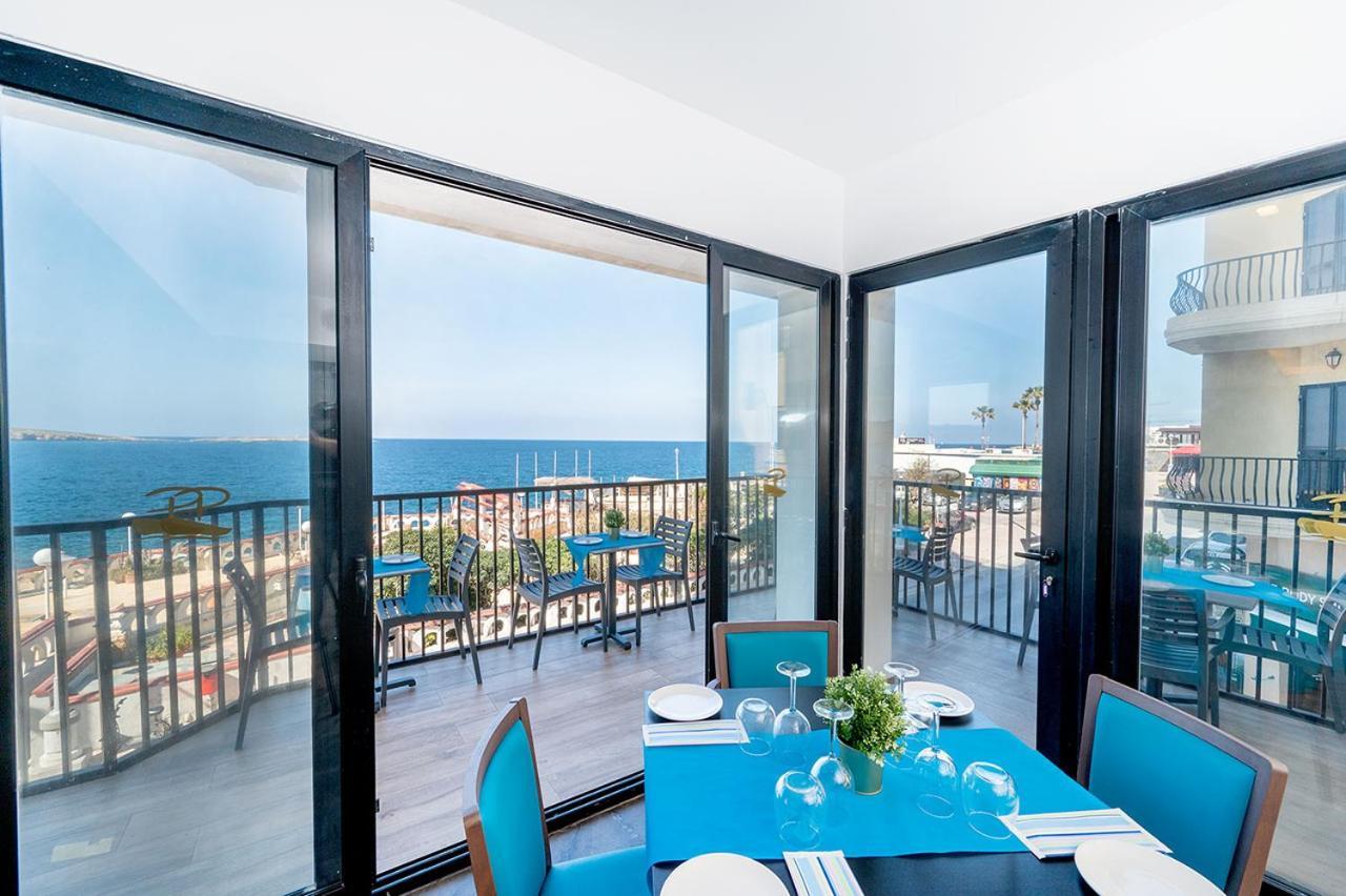 Islet Promenade Seafront Apartment With Large Corner Terrace By Getawaysmalta خليج سانت بول المظهر الخارجي الصورة