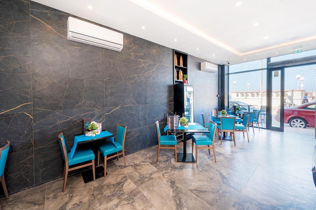 Islet Promenade Seafront Apartment With Large Corner Terrace By Getawaysmalta خليج سانت بول المظهر الخارجي الصورة